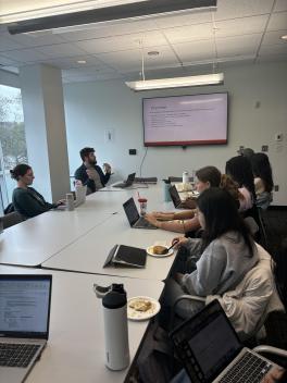 Students attending a workshop and eating breakfast