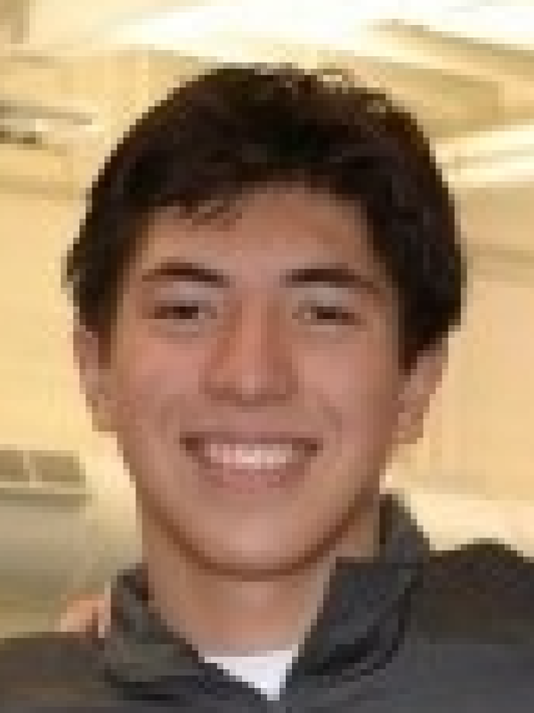 Anthony Herzog smiling on a headshot